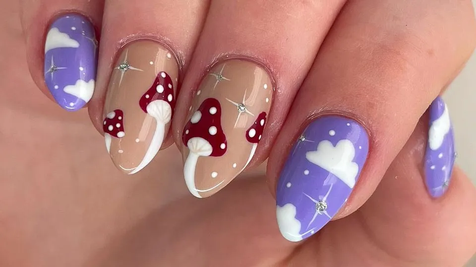 Finger nails with mushroom and cloud nail art